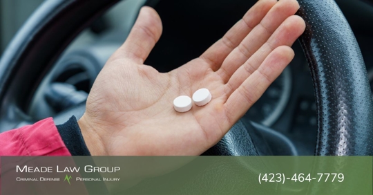 Driver with pills in their hand